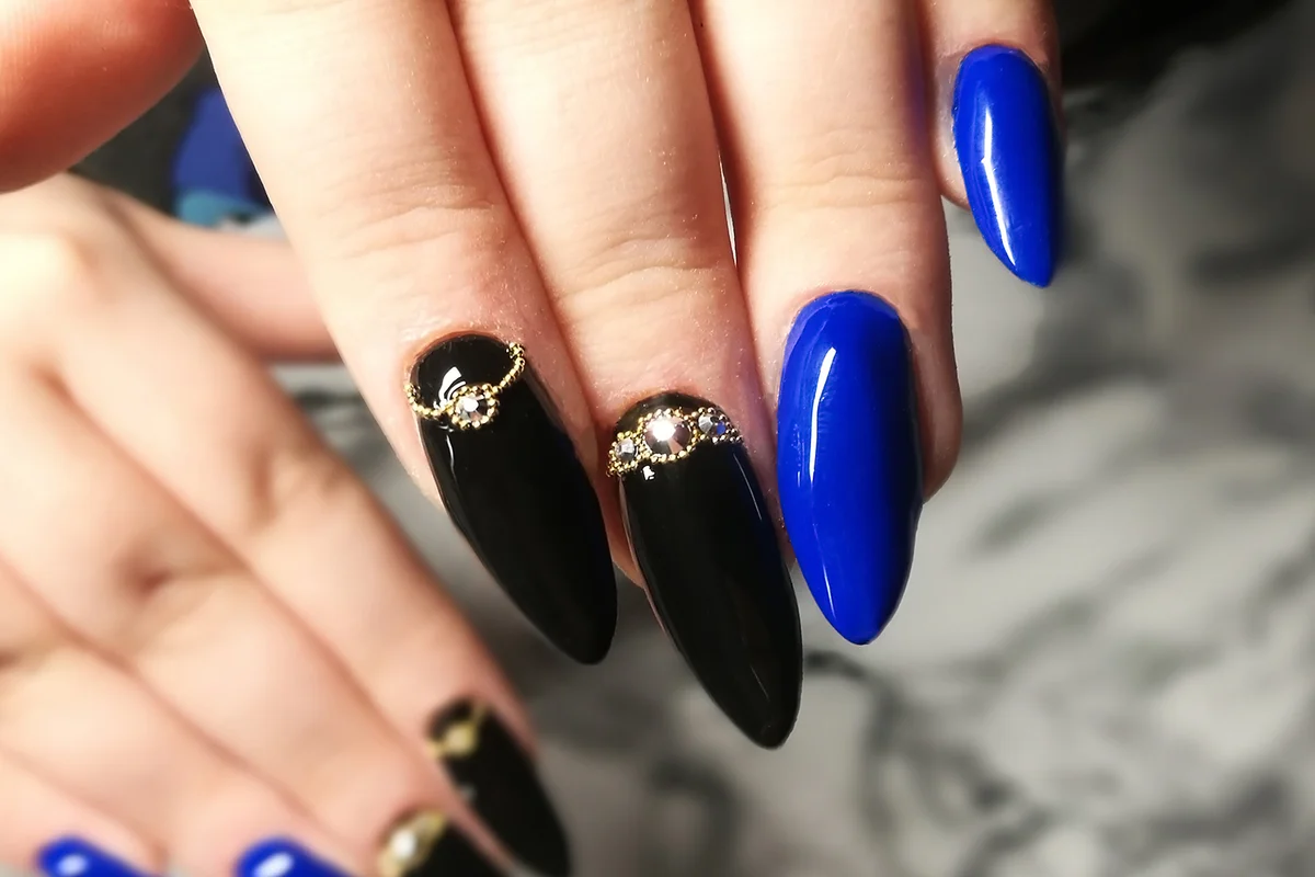 Woman Fingers With Nail Art Manicure with blue colour