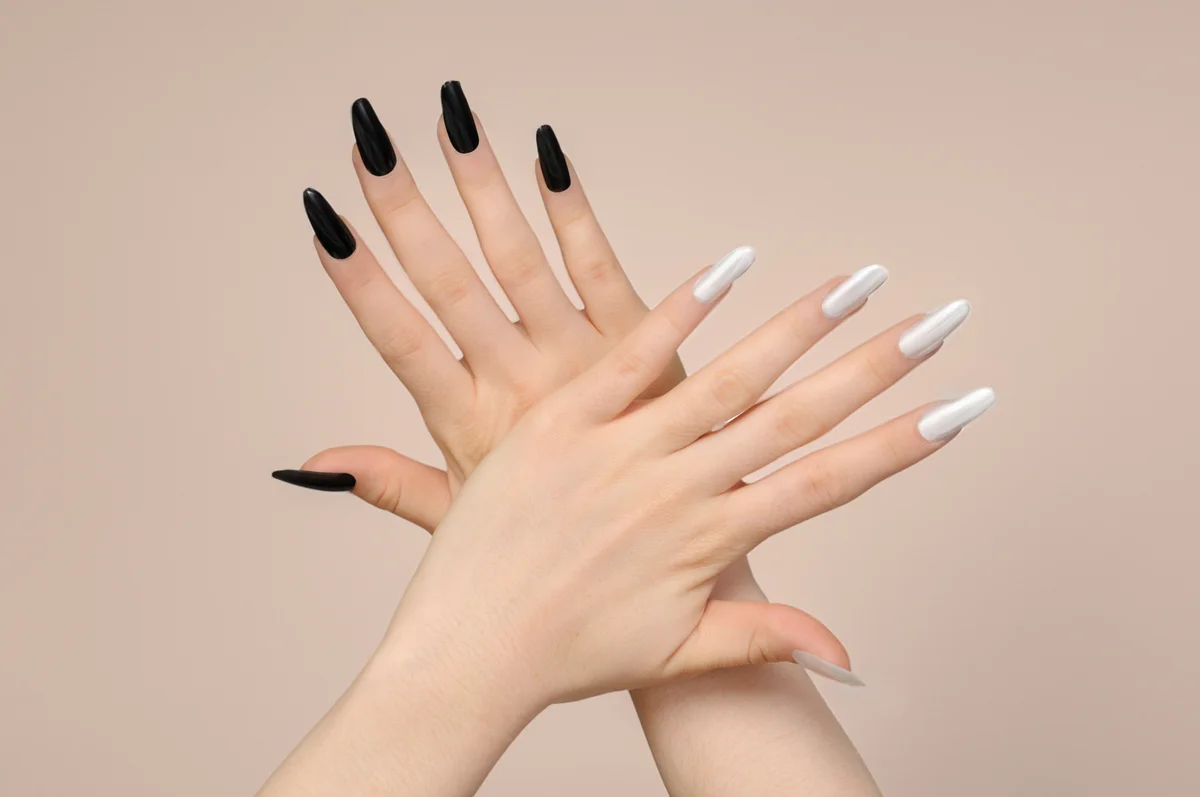 Woman's Hands with Black and White Nails