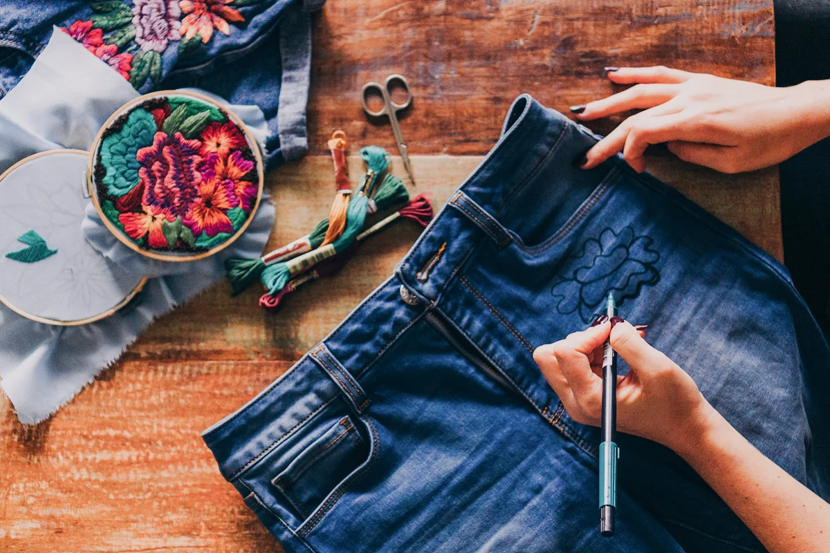 Young woman doing colorful embroidery