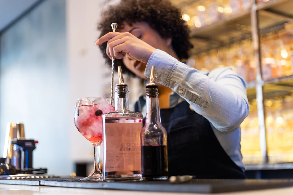 bartender stirring a drink