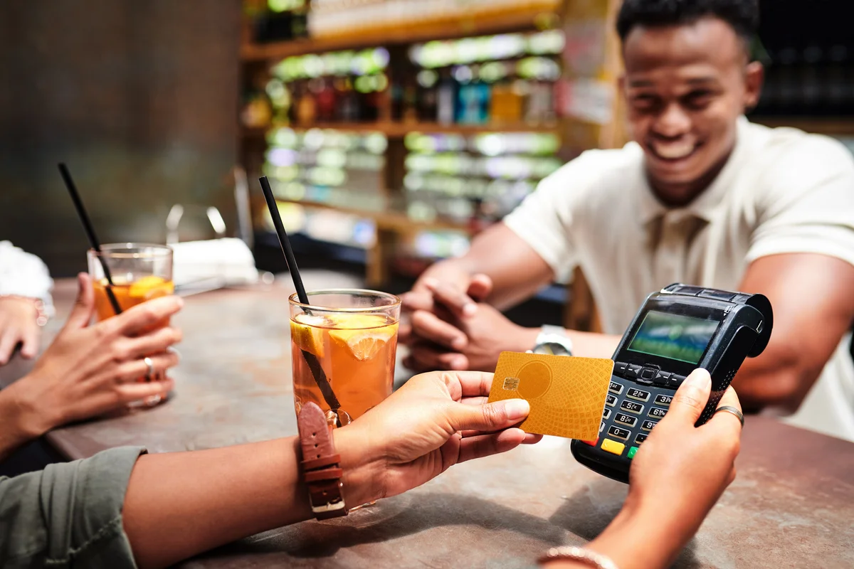 person paying for drinks