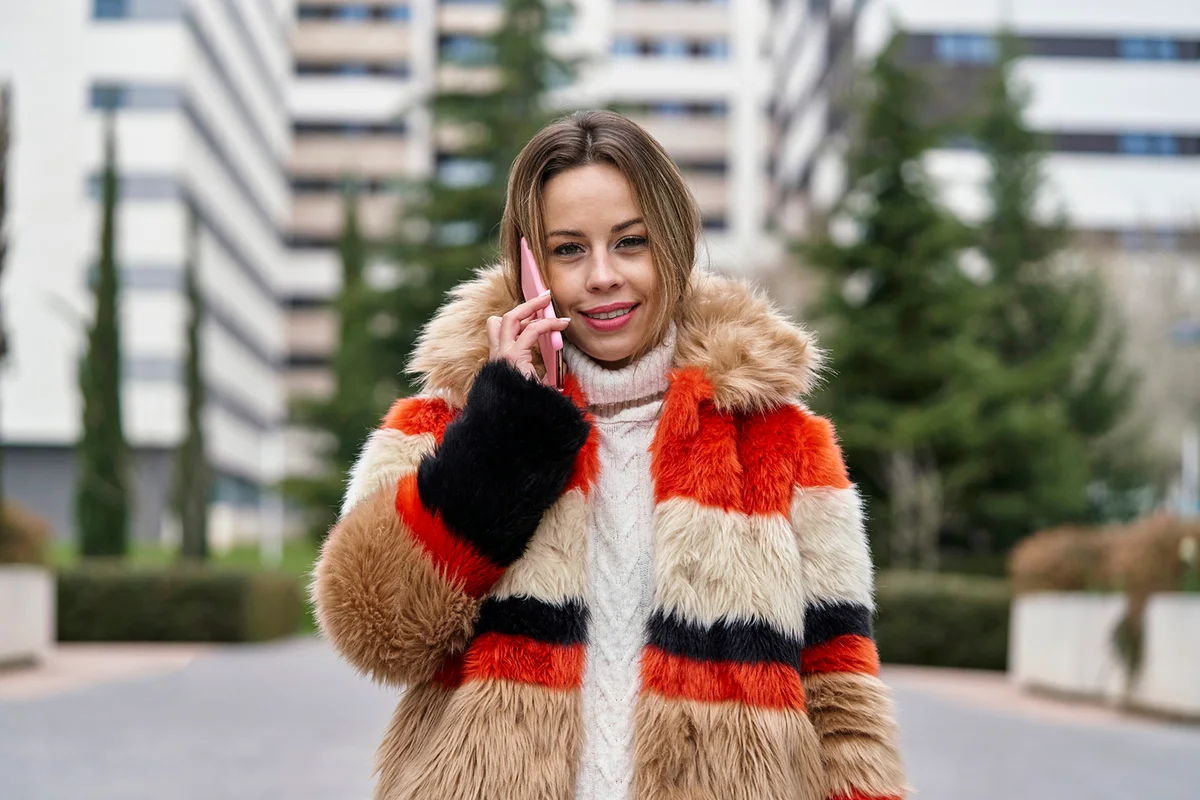 young woman smiling while walking