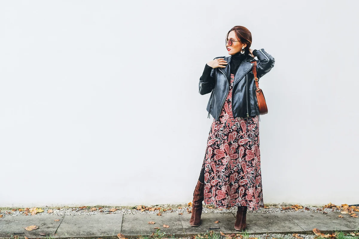 Smiling female dressed boho fashion style colorful long dress