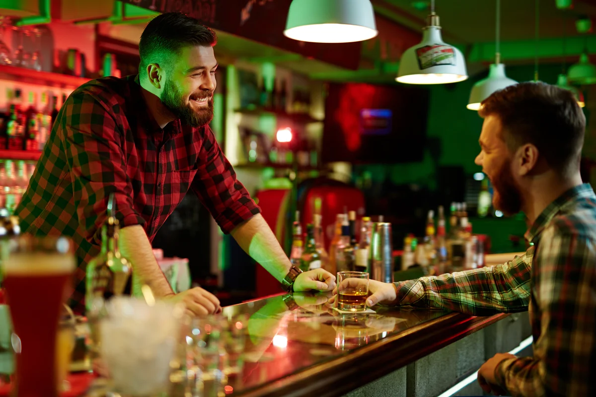 bartender and patron talking