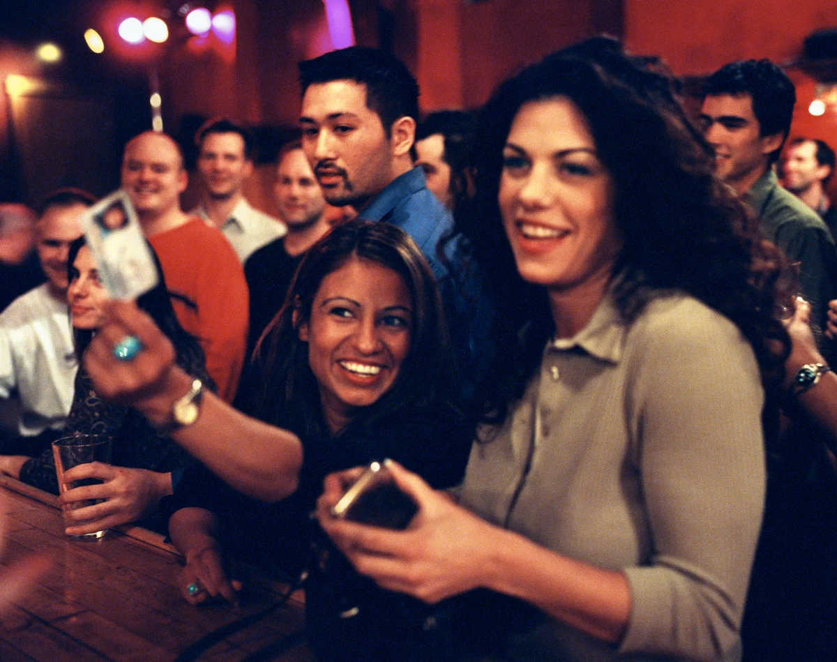 woman showing ID at a bar