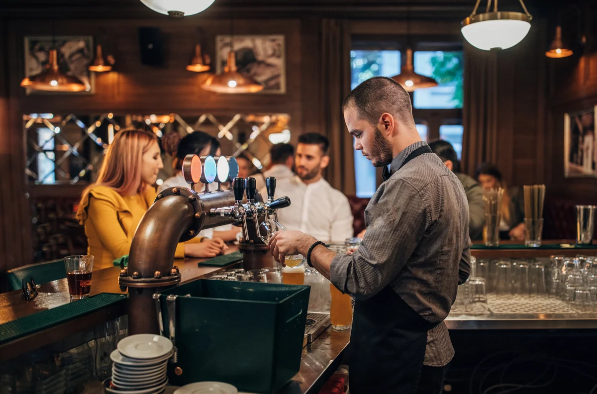 bartender pouring a beer