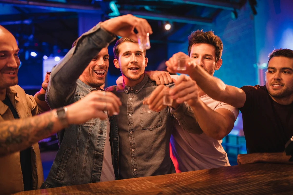 group of men doing shots