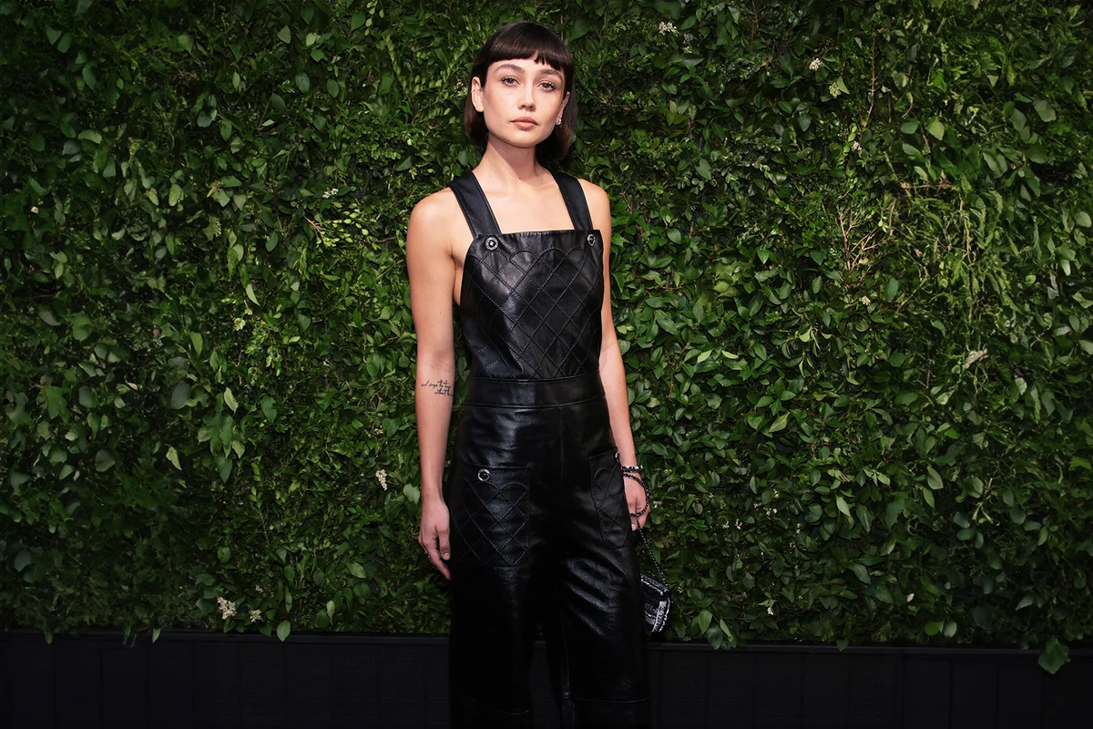 Woman wearing dark overalls