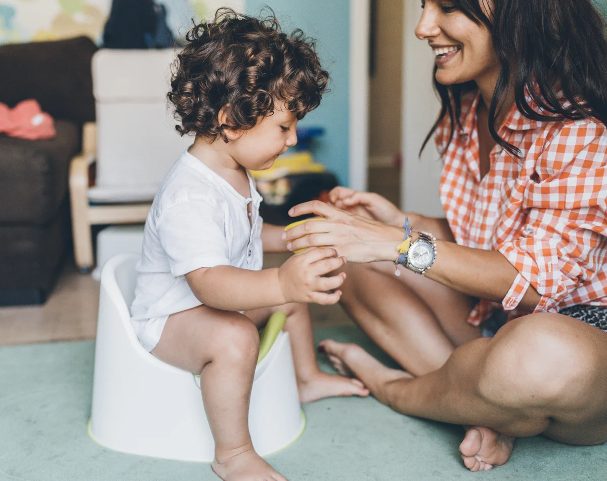 mom with son potty training
