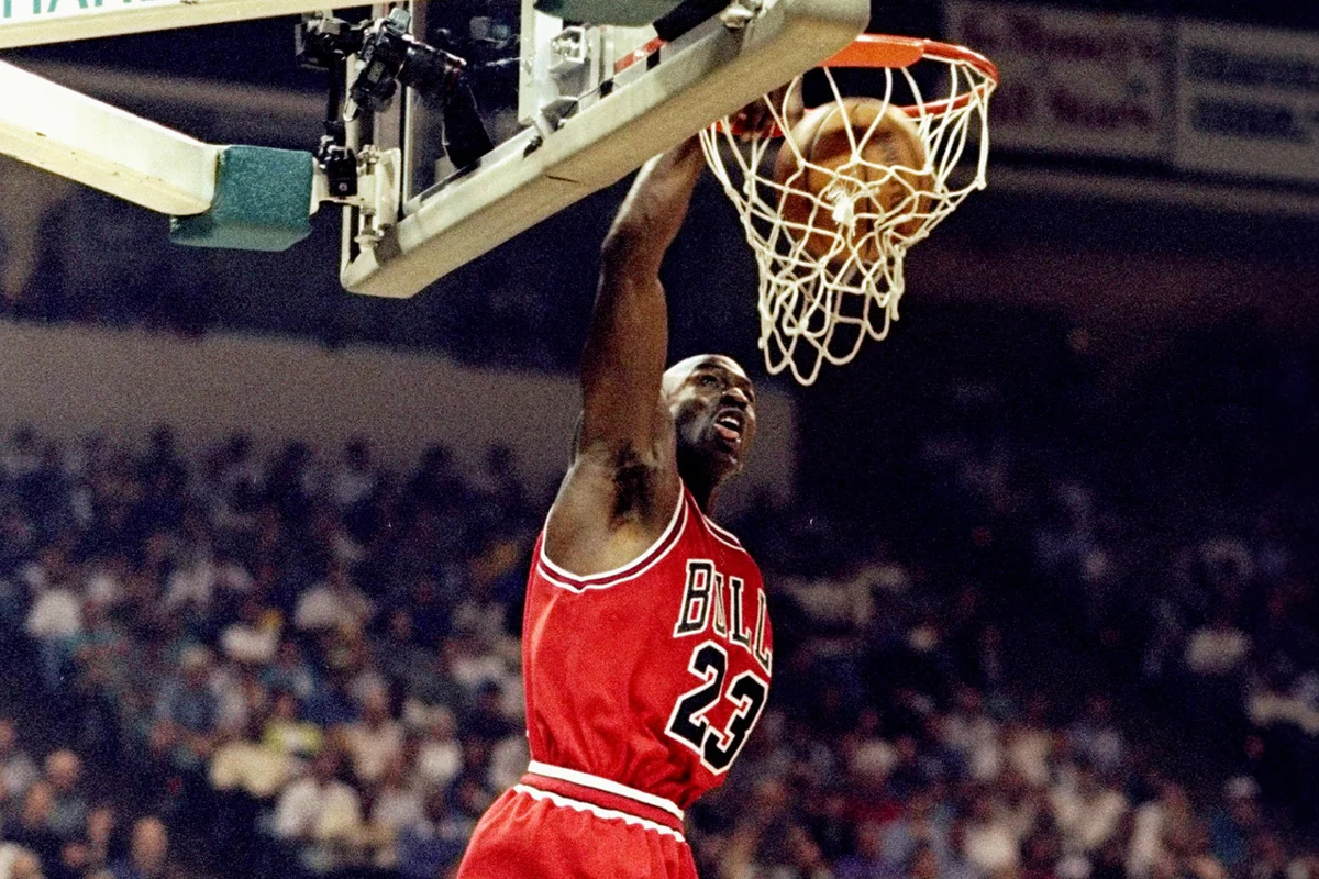 Michael Jordan 23 of the Chicago Bulls jumps slam dunk - Getty Editorial