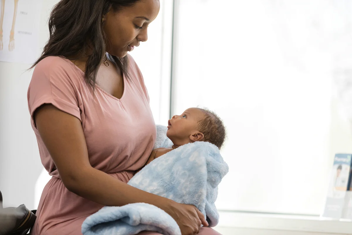 Alert baby makes eye contact with mother