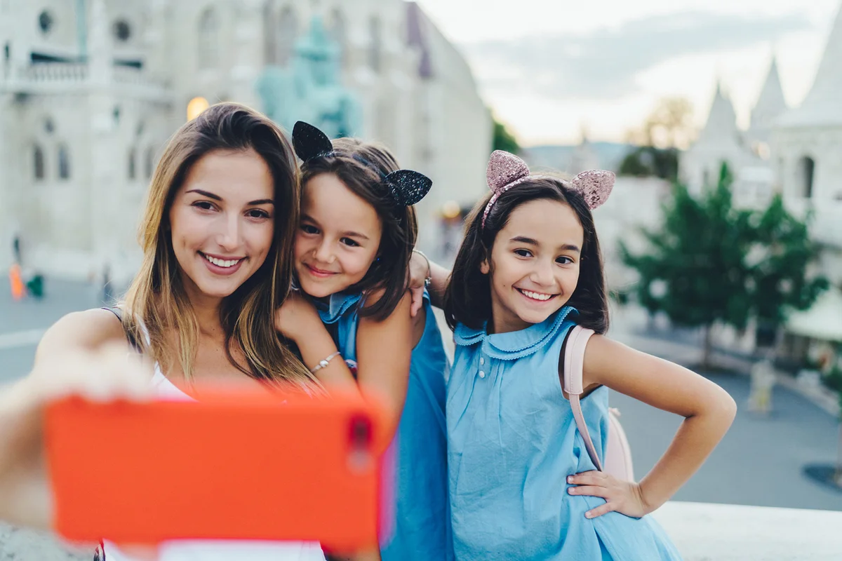 Family traveling around Europe and taking selfie