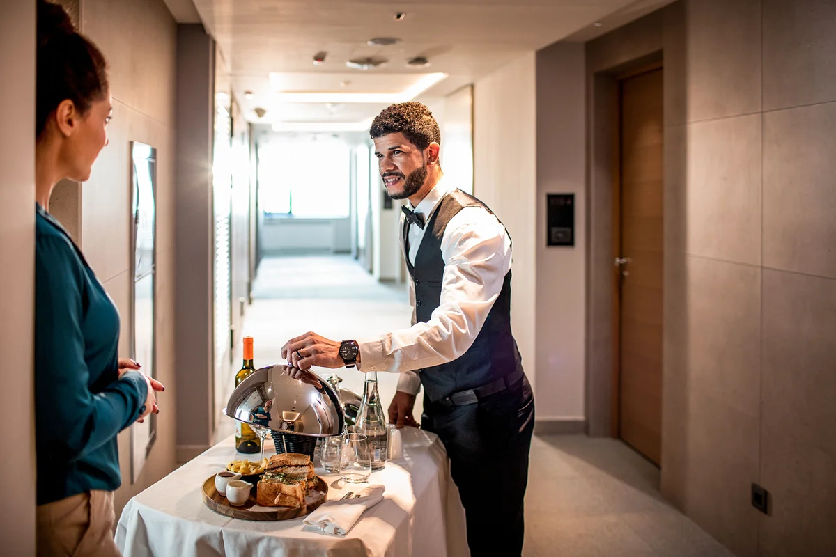 Waiter doing room service
