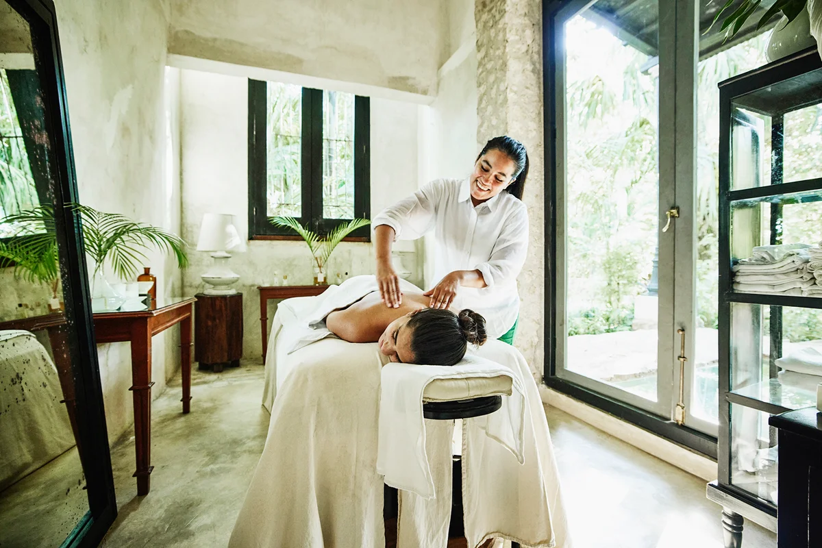 woman receiving massage at luxury spa
