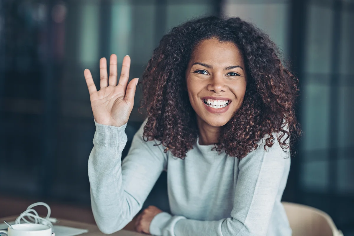 woman waving hello