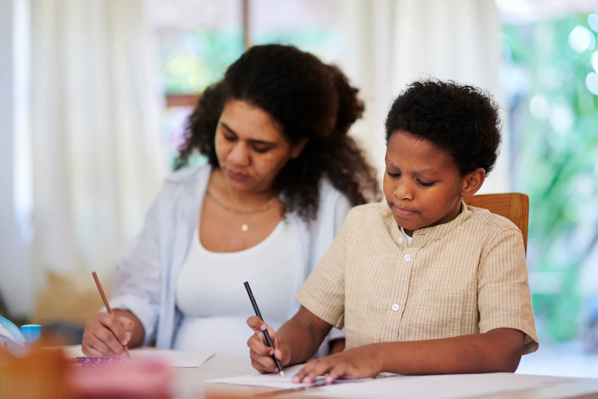 mom and son journaling