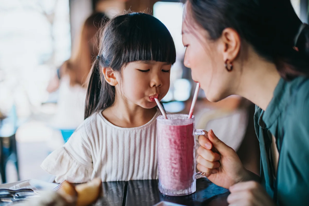 mom and child getting smoothie