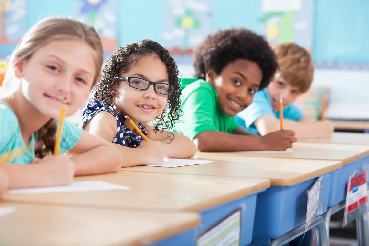 students smiling in classroom