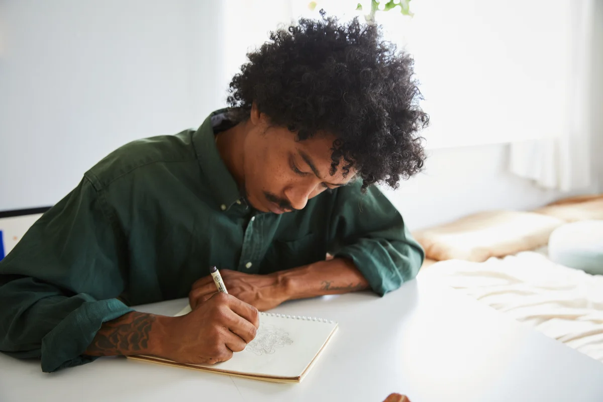 man sketching