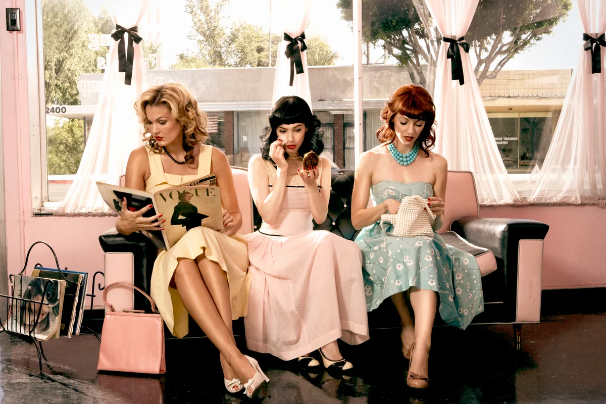 Women in vintage clothing waiting inside beauty salon