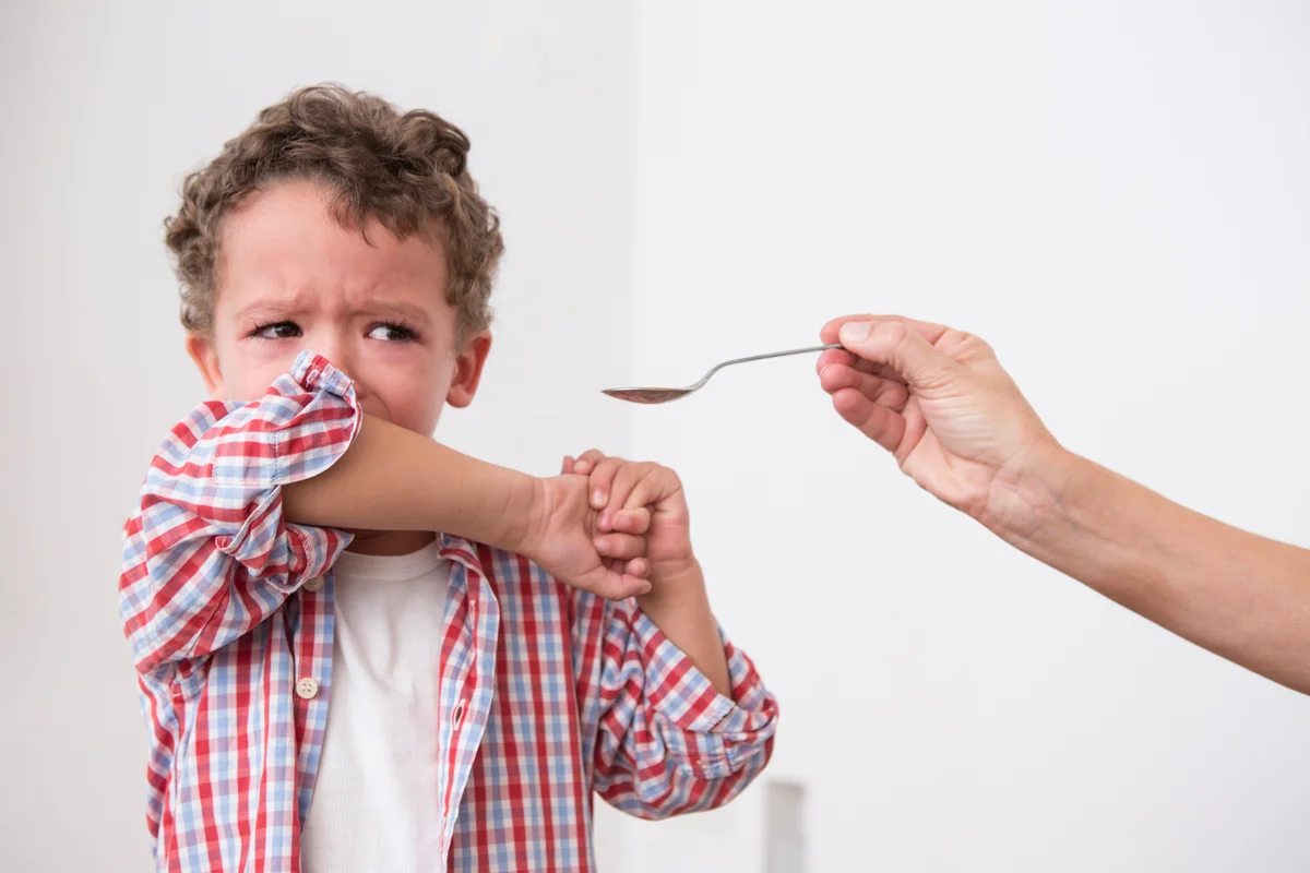 toddler crying and refusing medicine
