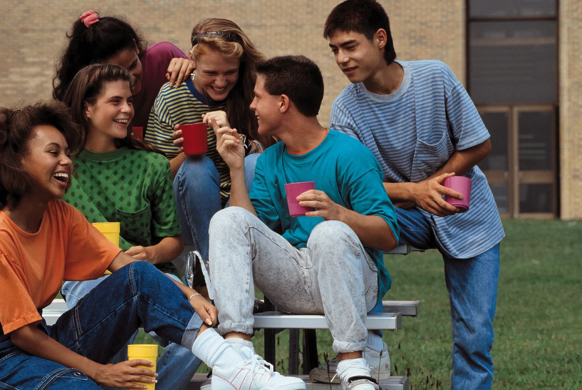 Group of teens in the 90s hanging out