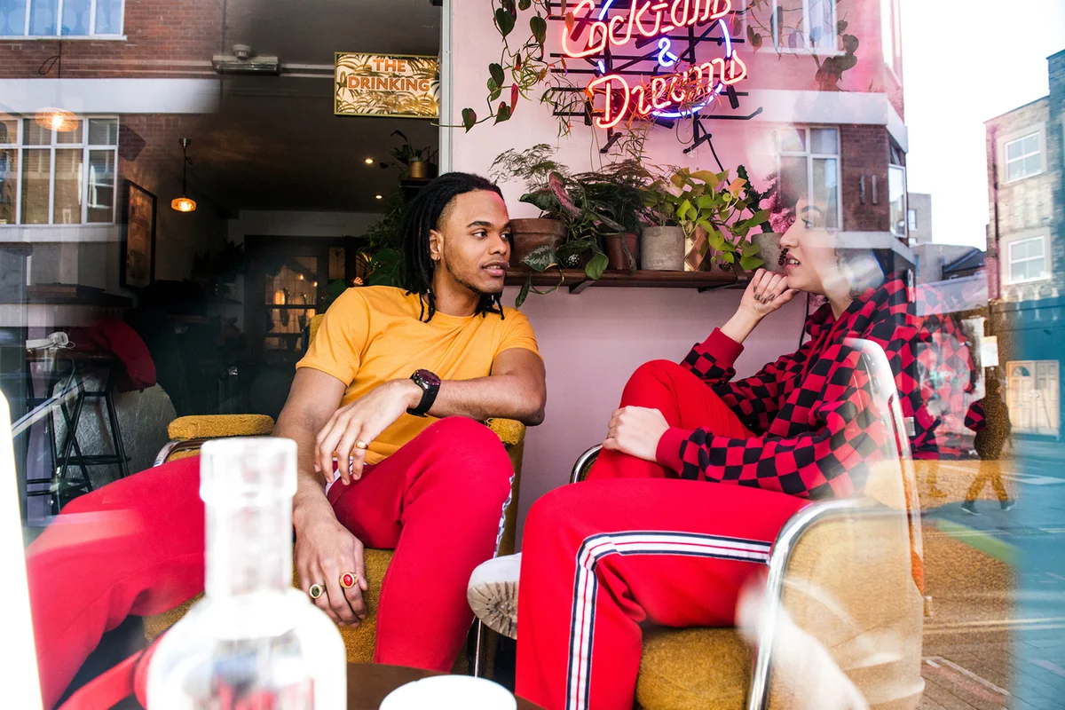Young friends chatting in bar