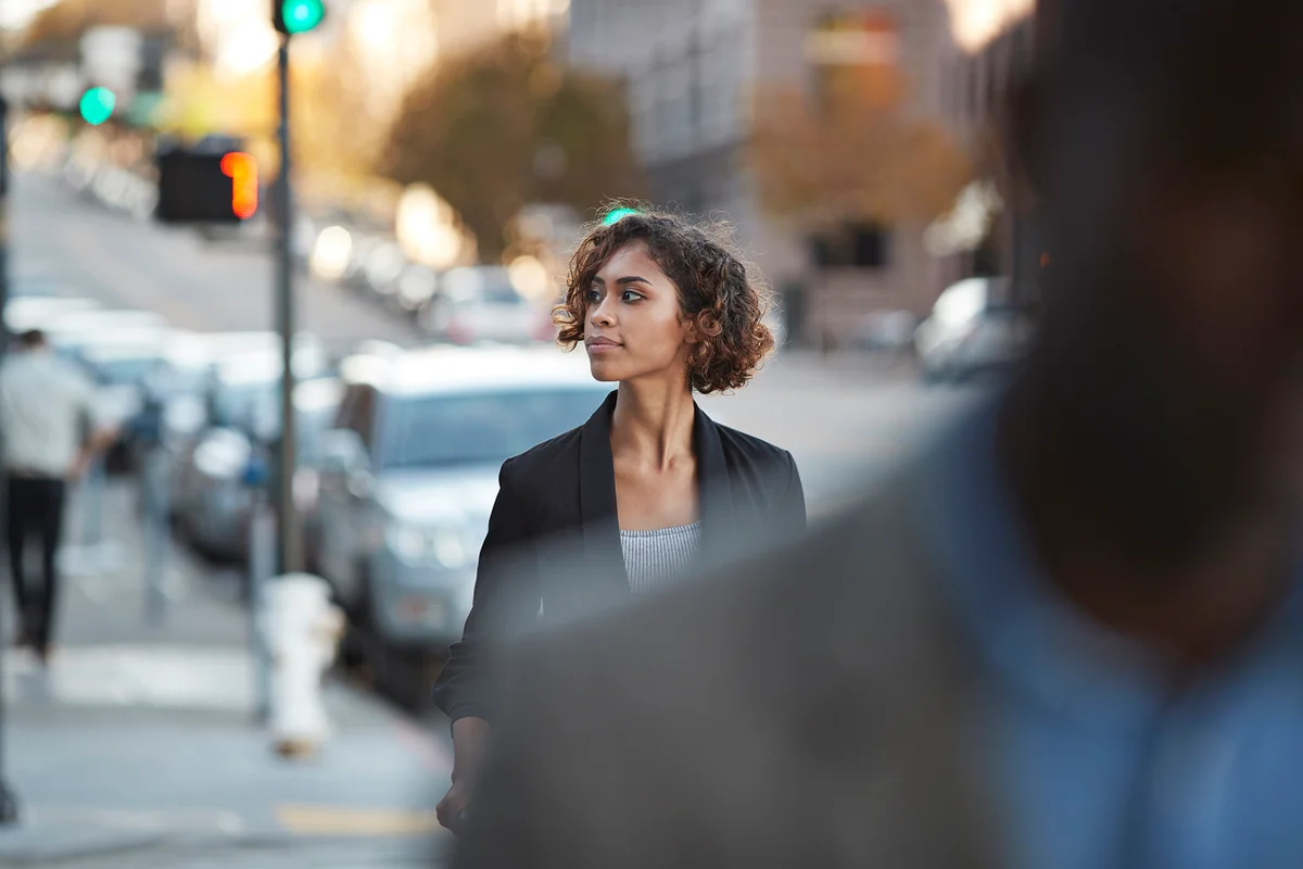 Businesspeople walking in pedestrian crossing