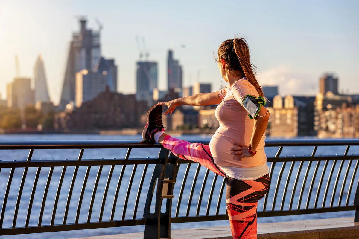 Pregnant woman does her stretching in London
