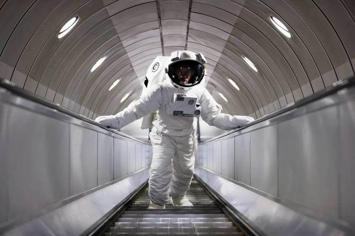 Astronaut using an escalator
