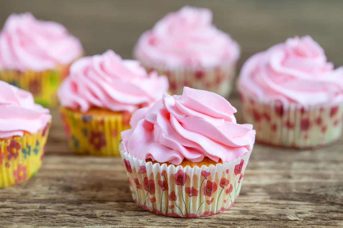 Vanilla cupcakes with pink frosting