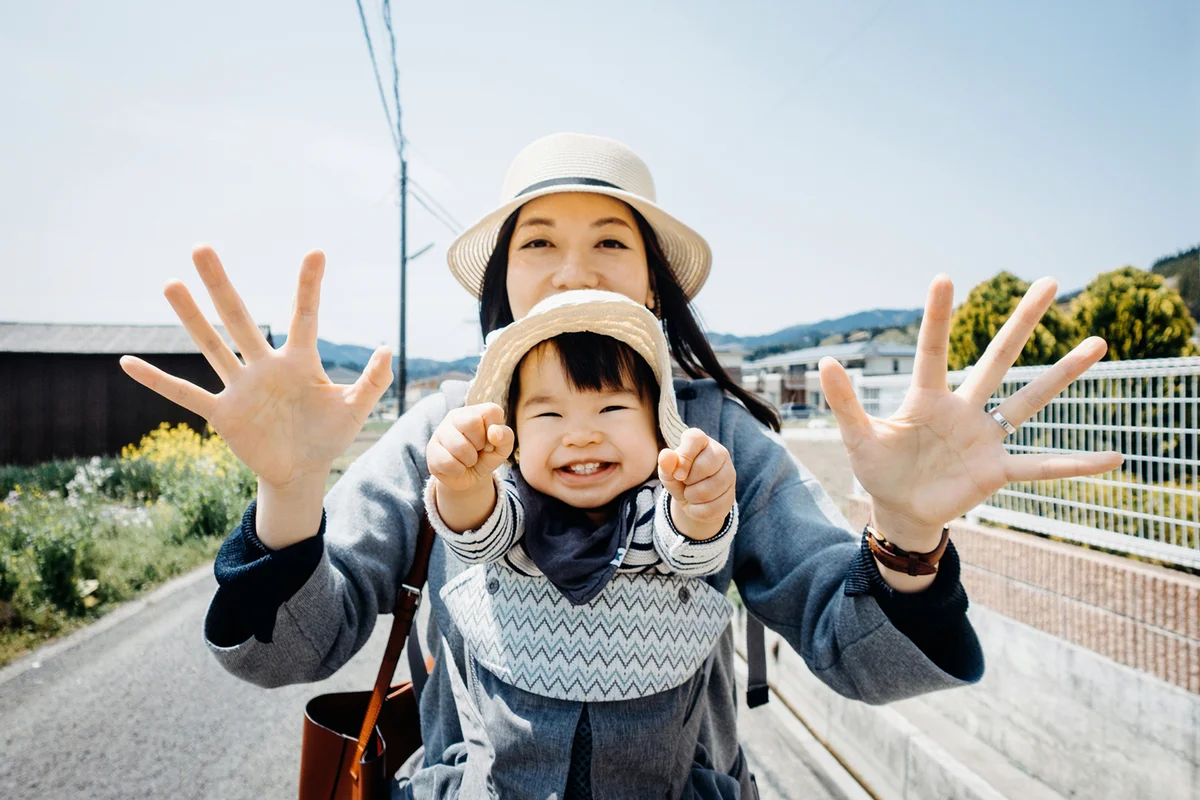 Joyful mother and daughter smiling happily