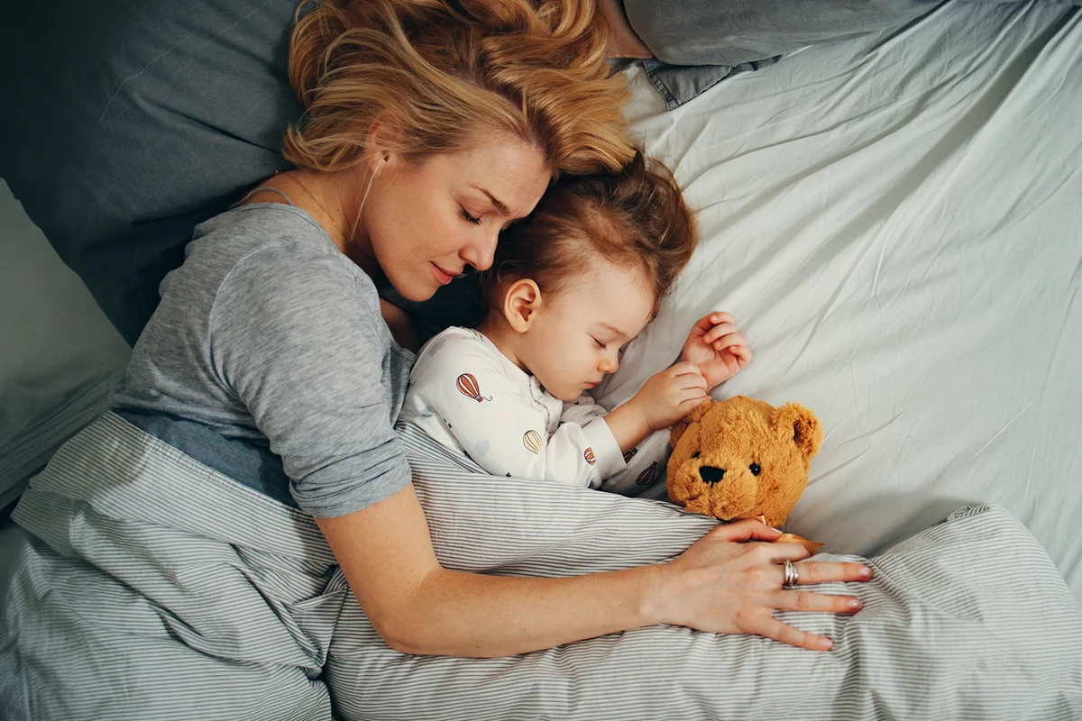 Mother and Child Comfortably Sleeping on their Side in the Morning