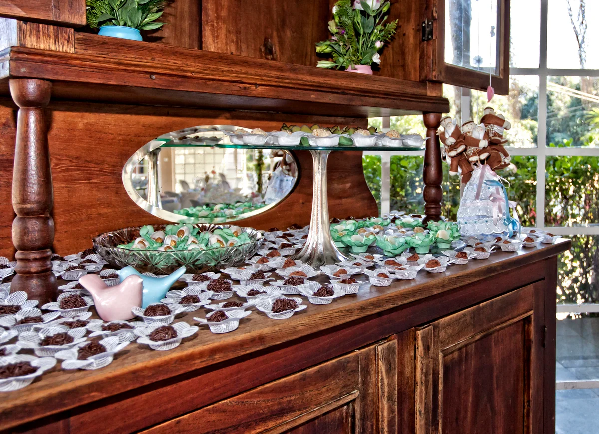Beautiful antique cupboard used to display treats at a wedding