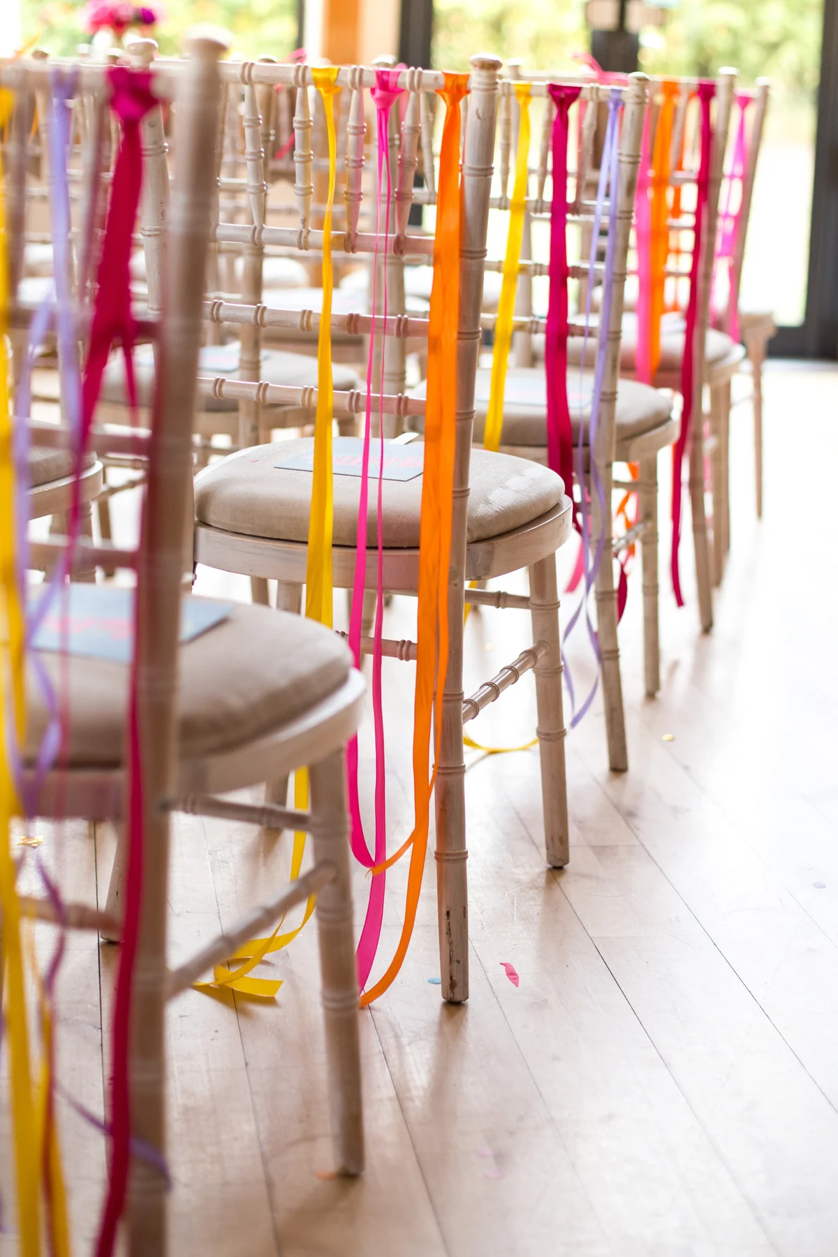 Chairs decorated with colorful ribbon