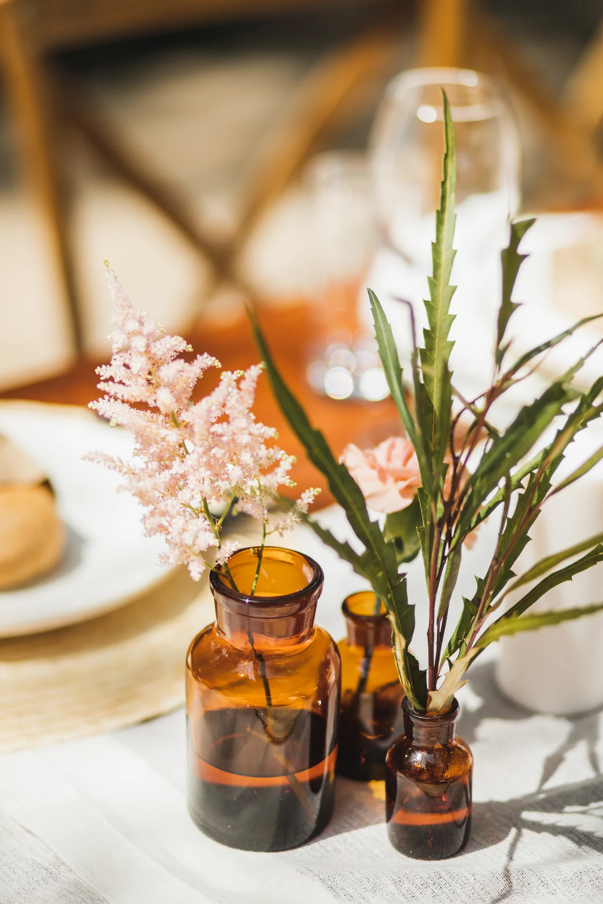 Vintage glass bottles used as wedding centerpiece