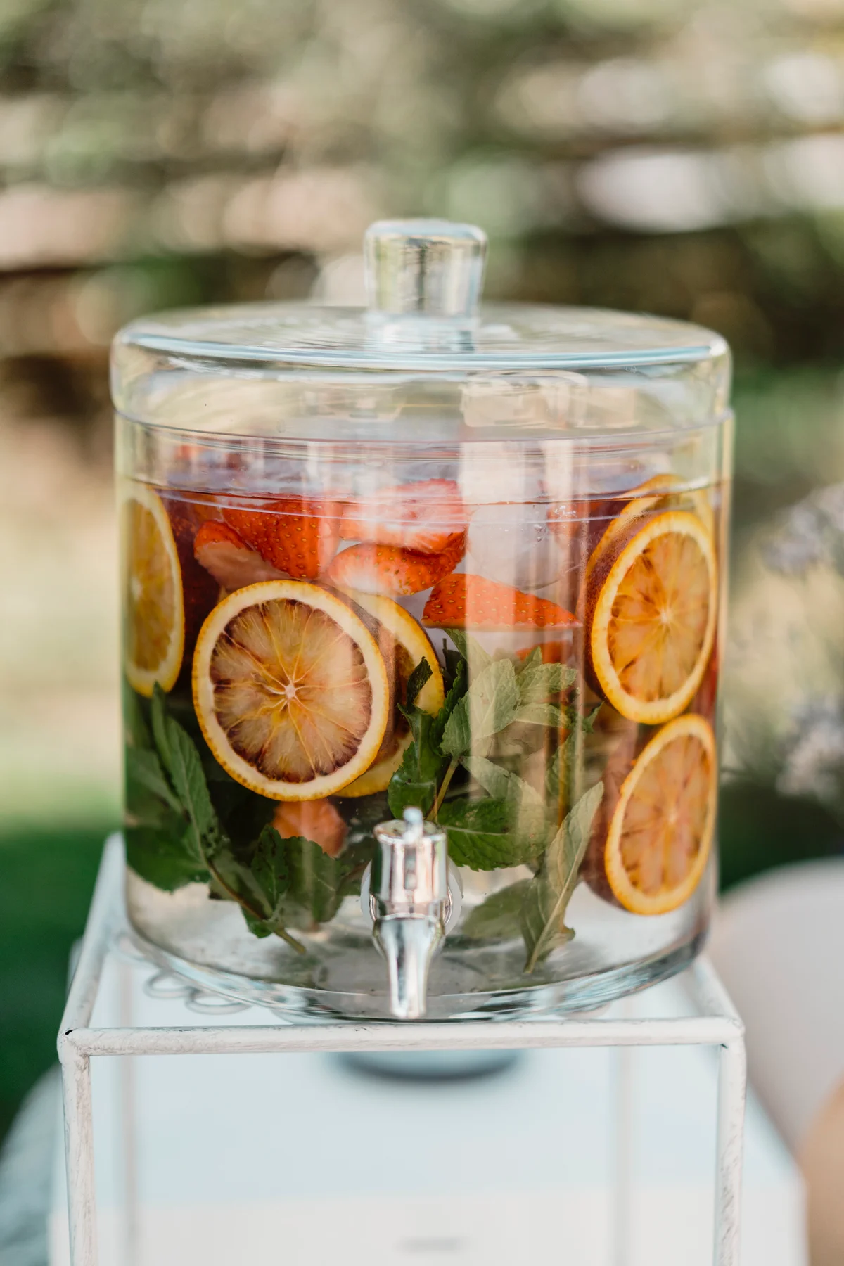 Fruit infused water dispenser at wedding