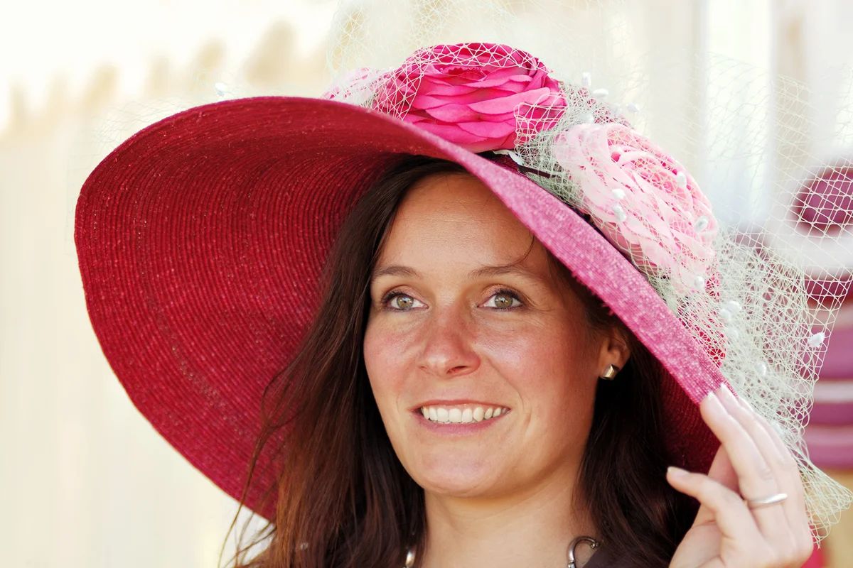 woman wearing an elegant victorian style hat
