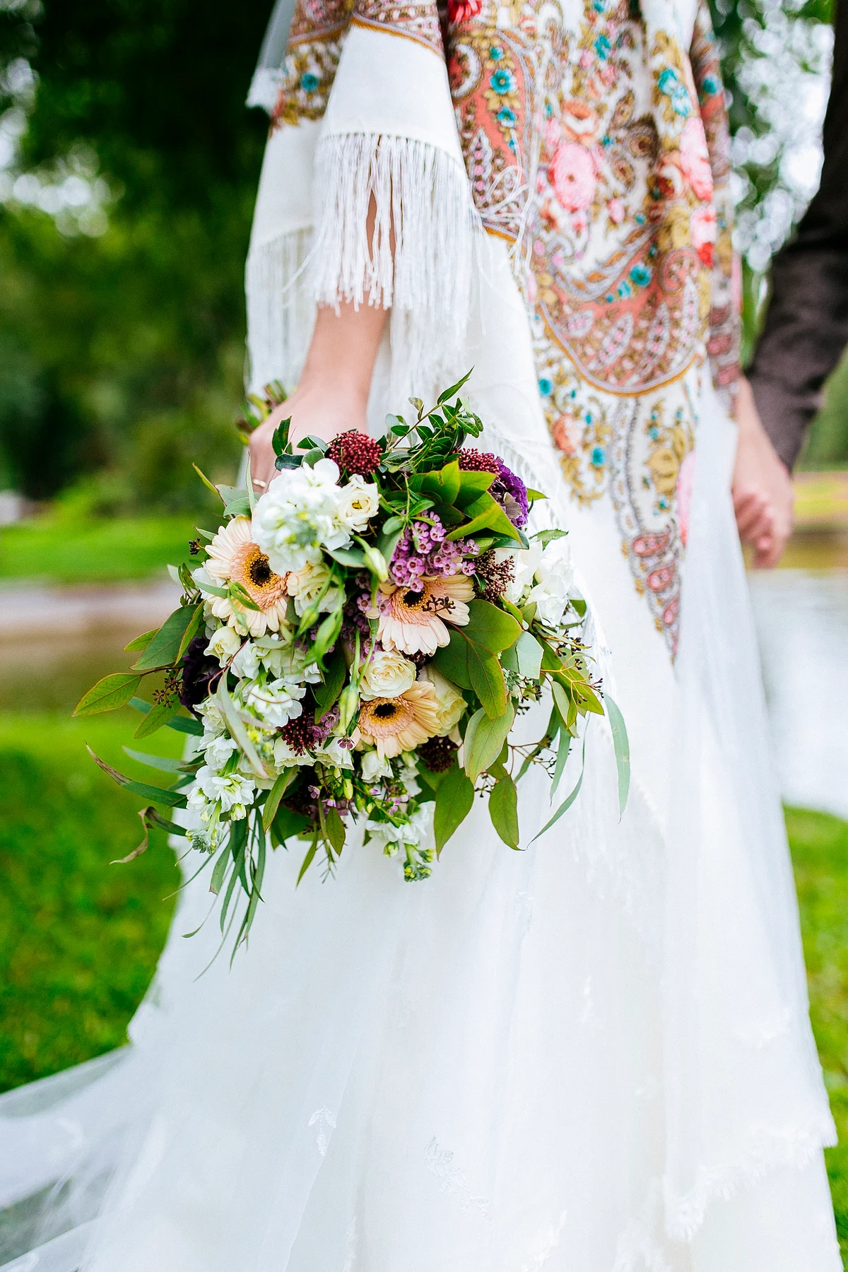 Bride wearing colorful boho accessories