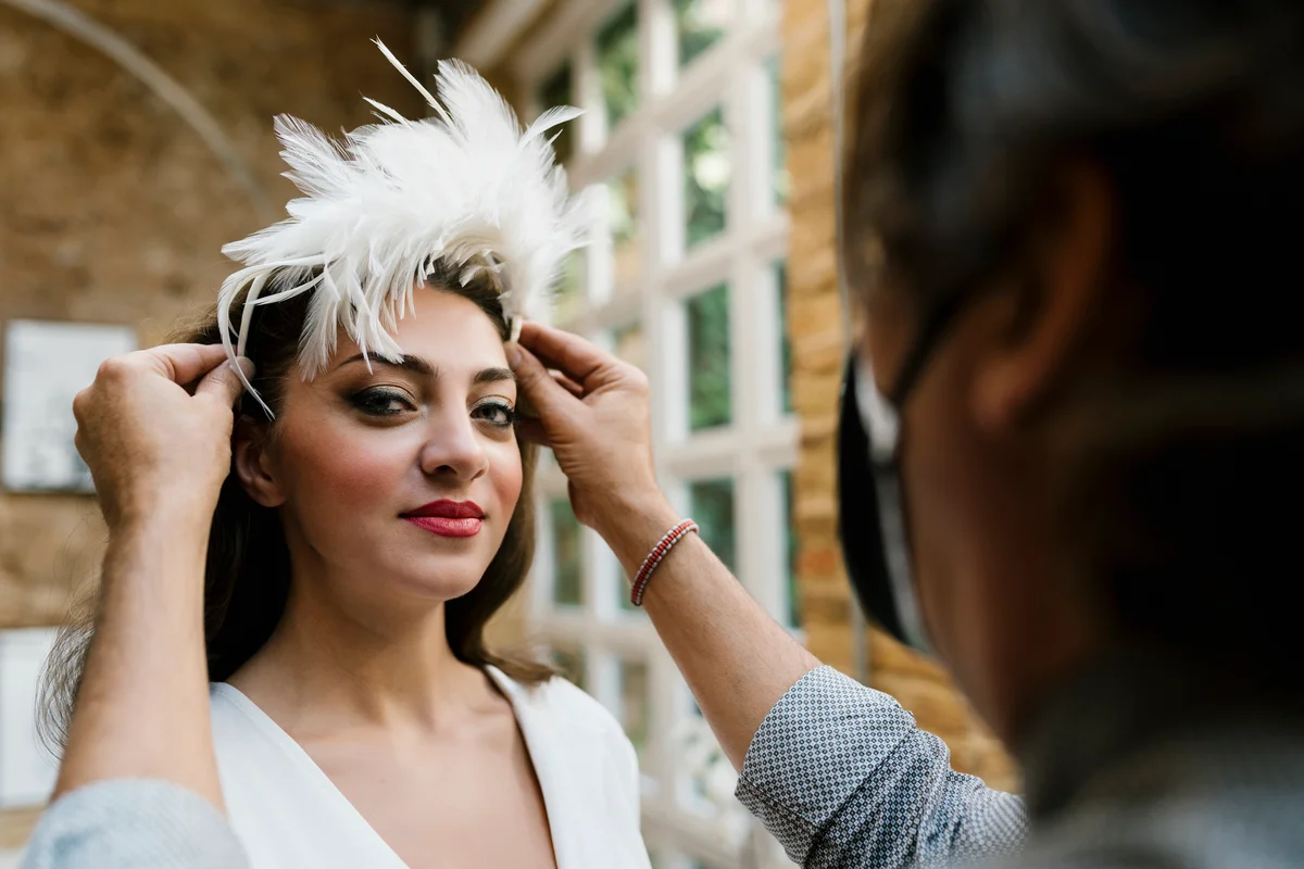 Boho bride with white feature piece in hair