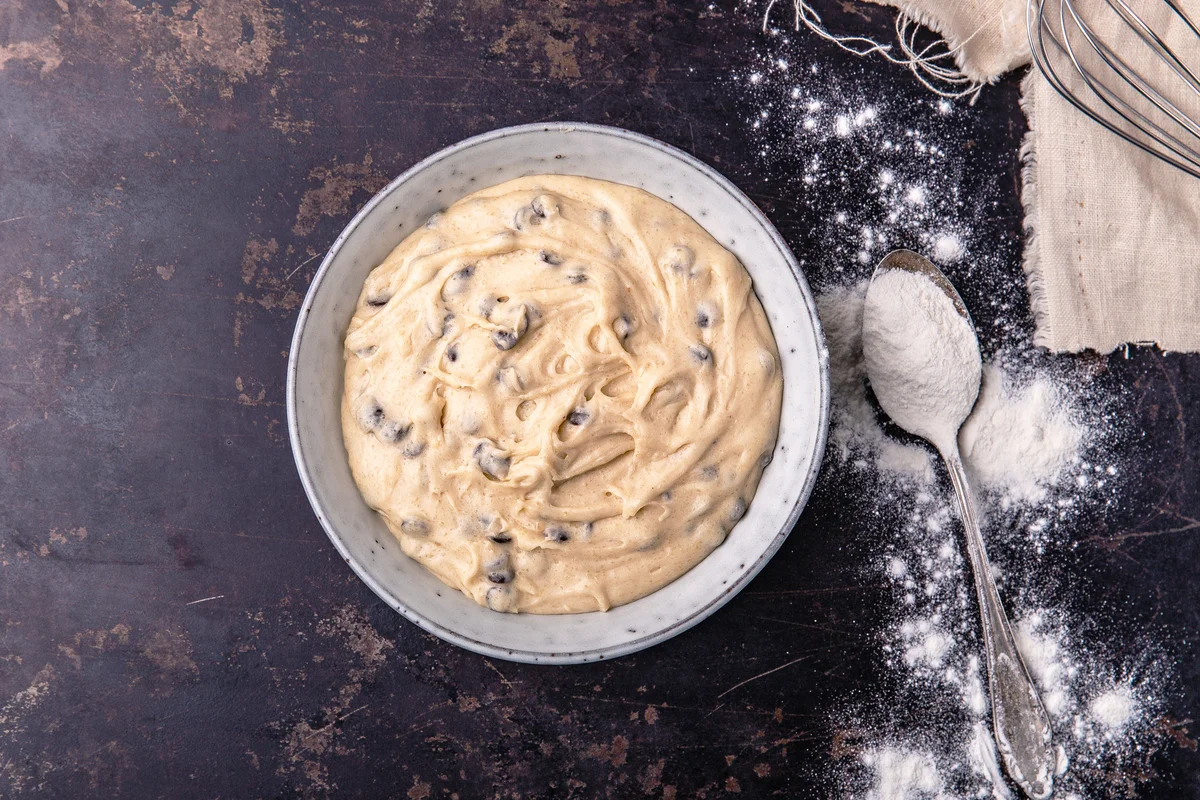 Blueberry cookie dough in bowl on table