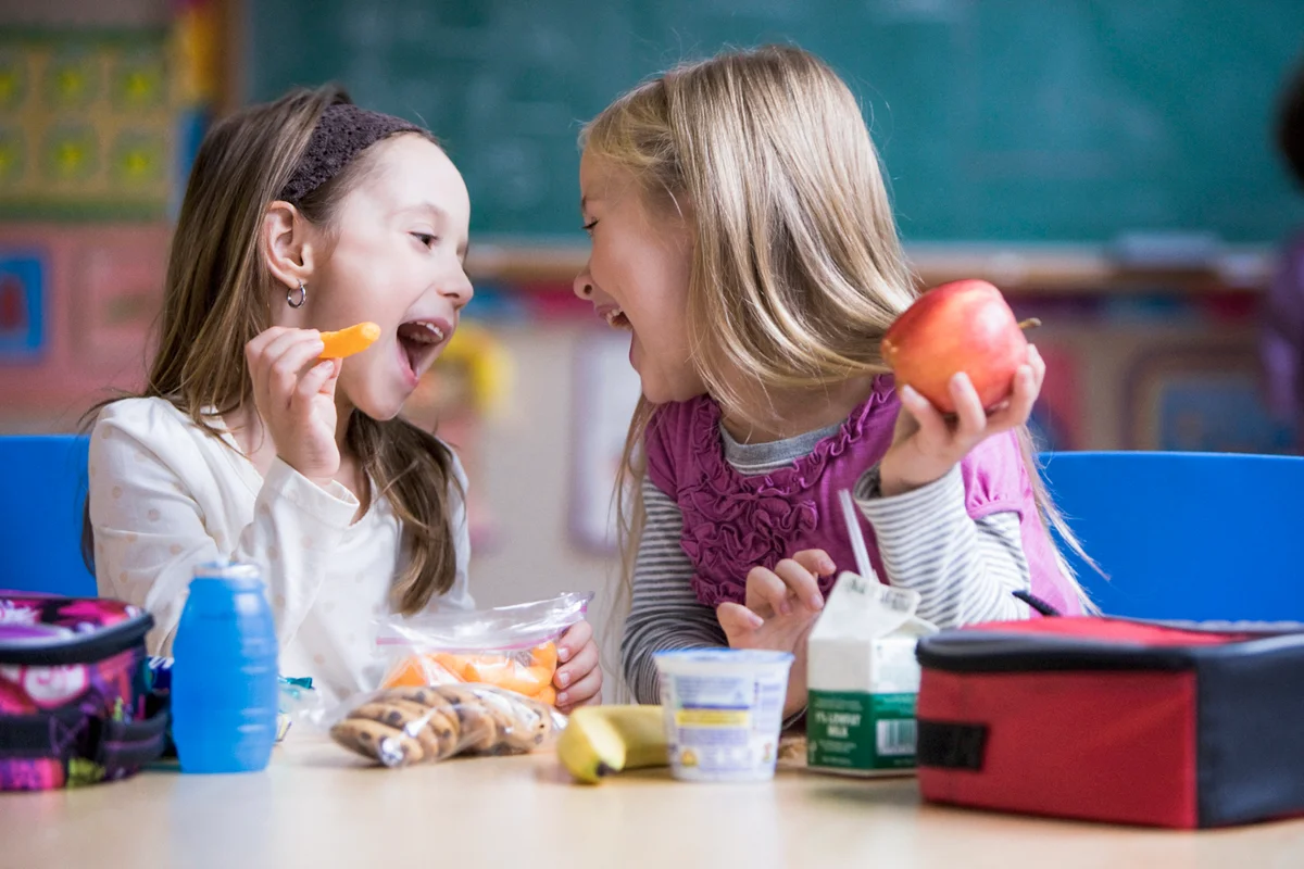 Students eating lunch in classroom