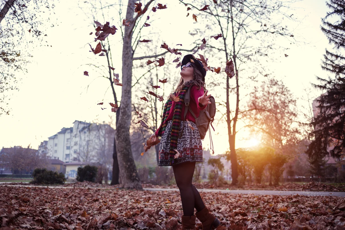 woman in tights and skirt fall outfit