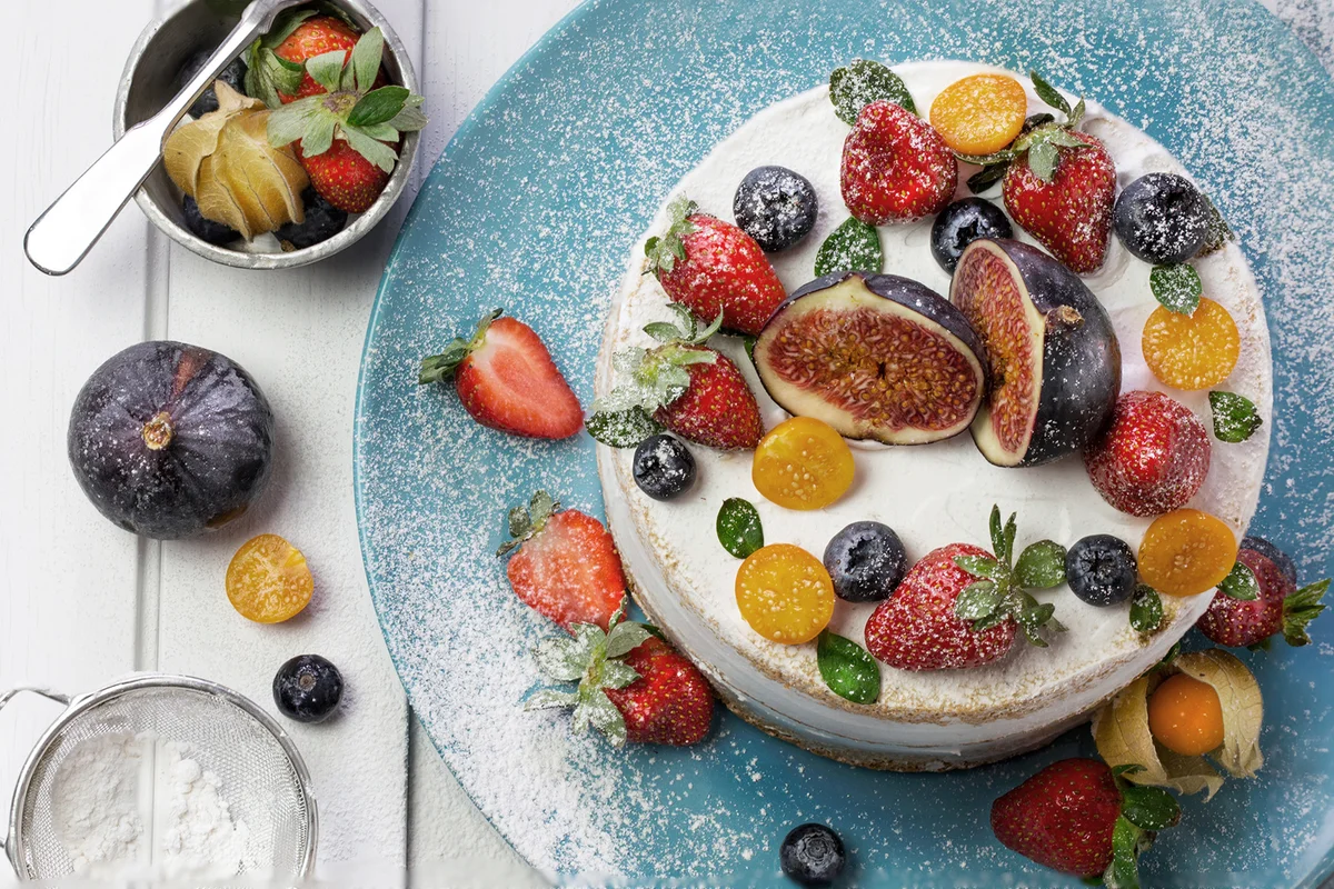 Overhead view close up fresh berry, fig fruit cake
