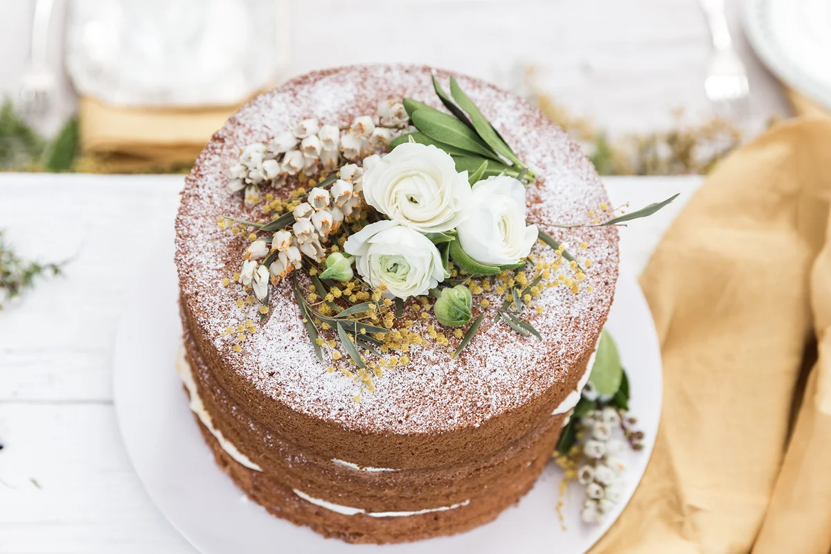 Triple layer victoria sponge cake on a table