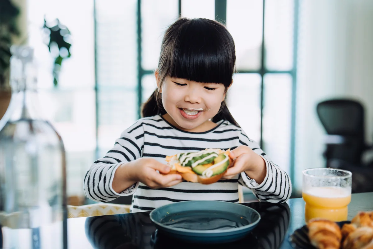 little girl eating lunch