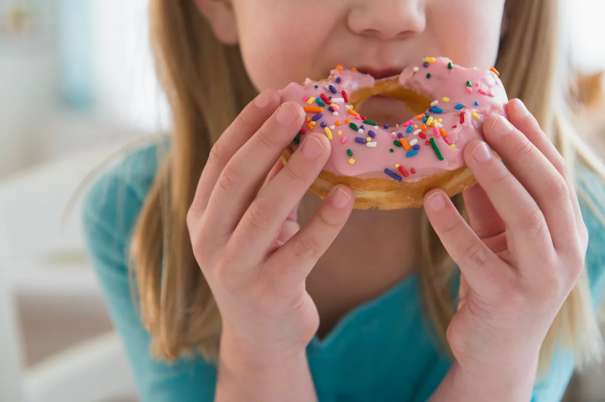 girl eating a donut