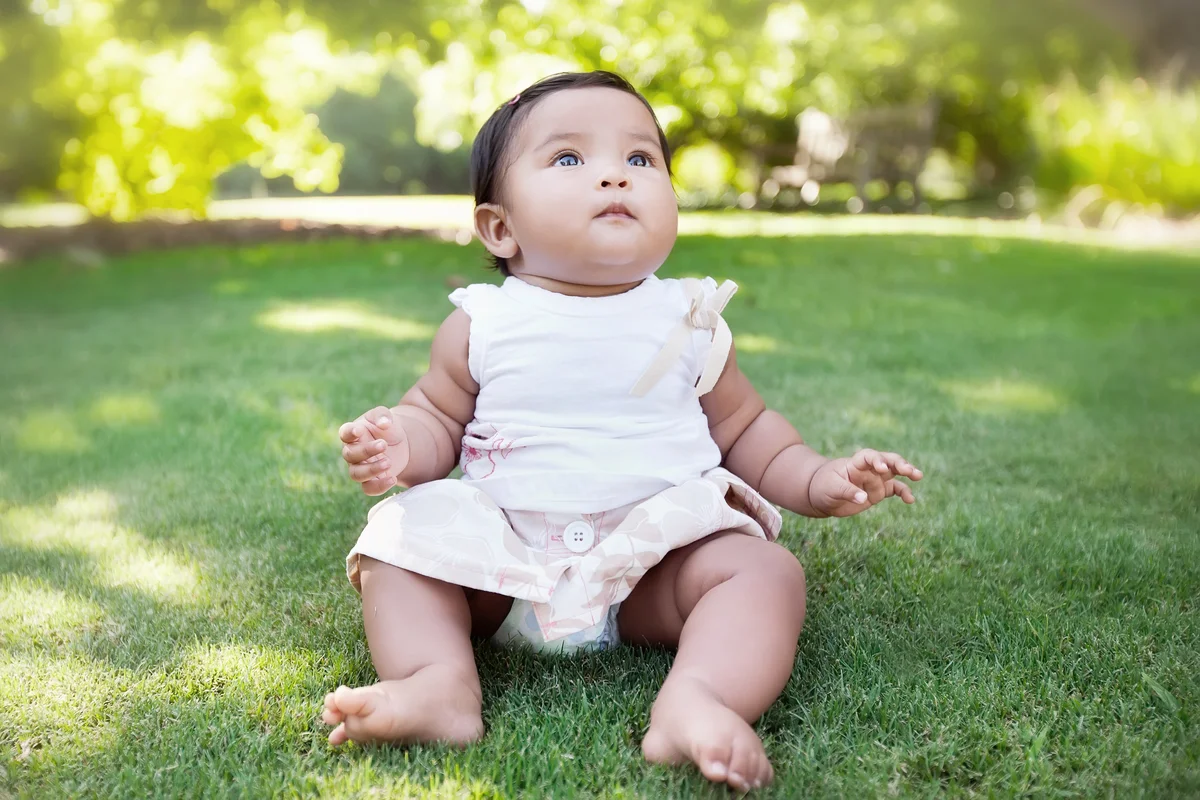 Young baby girl gazing at the sky