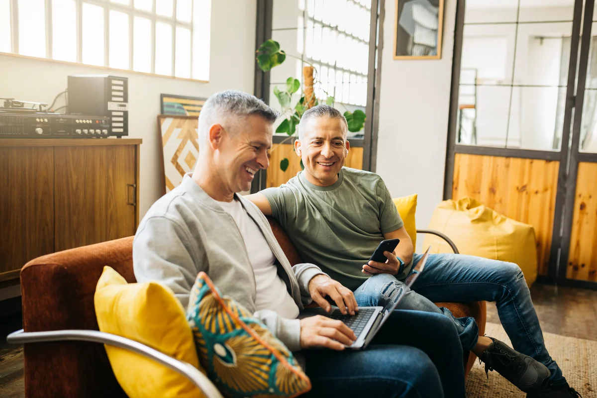 couple on couch with computer