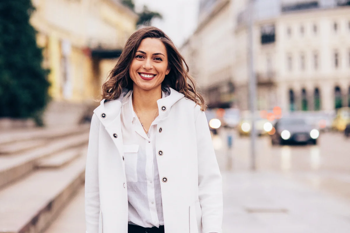 Happy woman wearing white